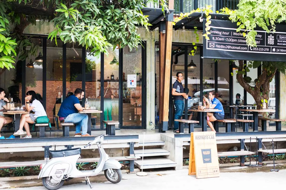 People sitting outside at Ristr8to cafe in Coffee Street in Chiang Mai