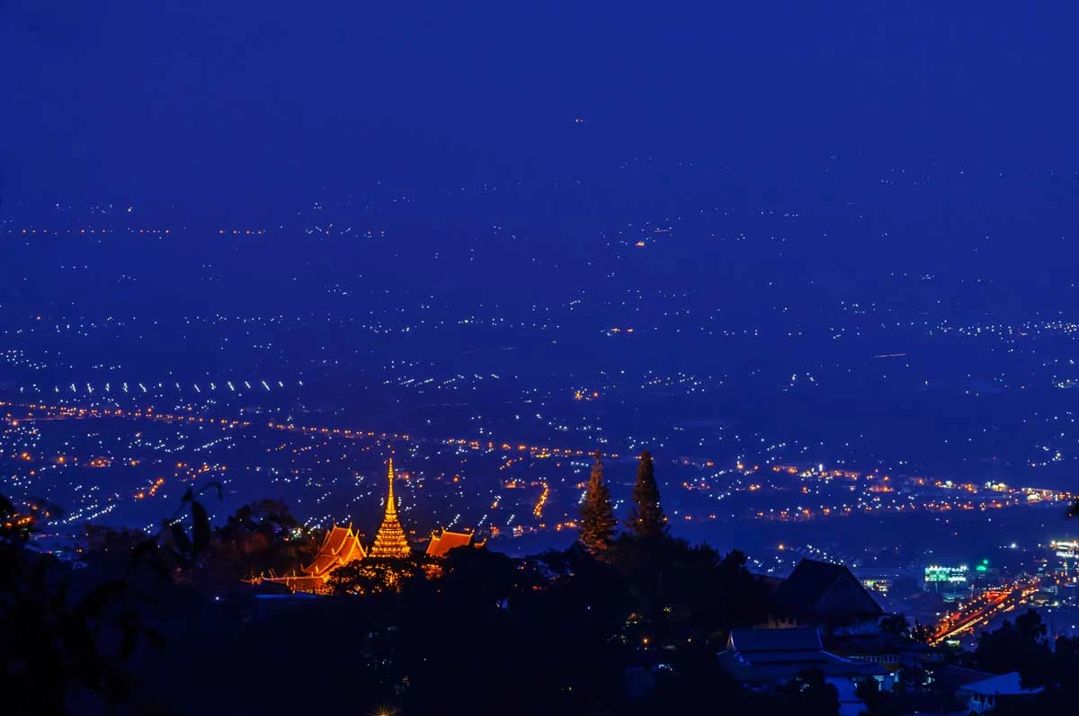 Night lights of chiang Mai with Wat Phra That Doi Suthep temple lit.