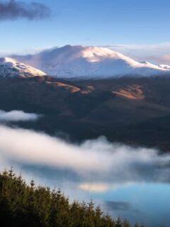 View of Ben Lomond Mountain Scotland with cloud shrouding the top of the mountain when hiking in Scotland