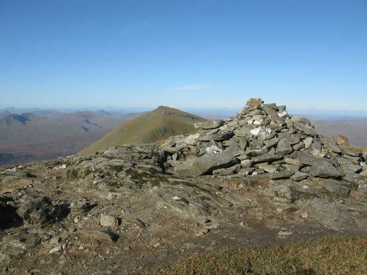 Hiking trail Stob Binnein Summit Cairn north towards Ben More, Scotland.