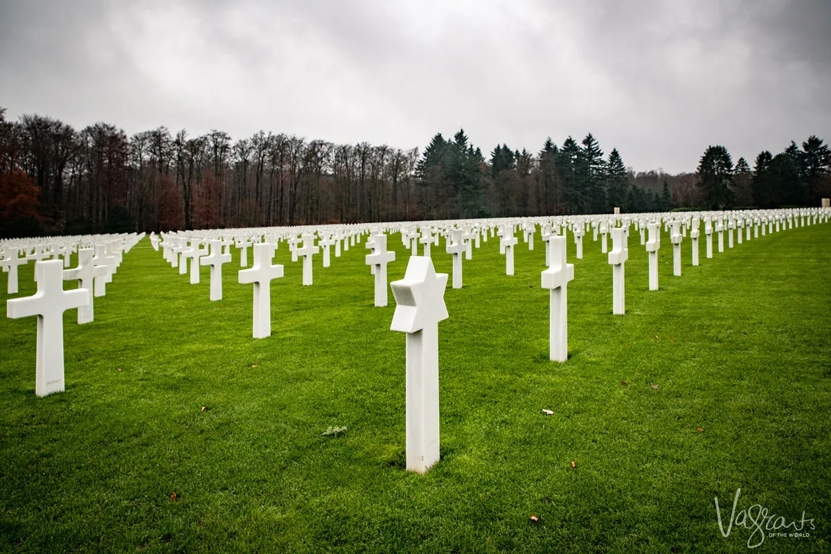 Looking over all the crosses on the bright green grass at the Luxembourg American Cemetery