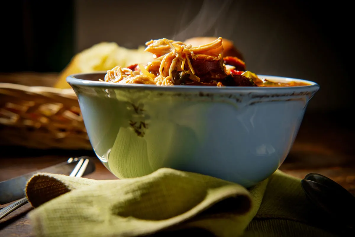 A close up of a steam bowl of gumbo