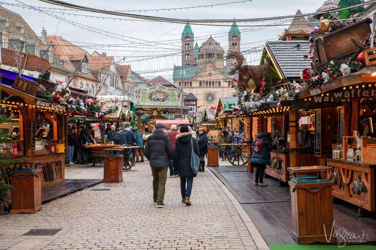 The main thoroughfare of Speyer Germany filled with christmas Markets and the Cathedral in the background