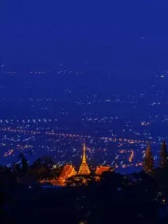 Night view of chiang Mai with Wat Phra That Doi Suthep temple lit up in the foreground