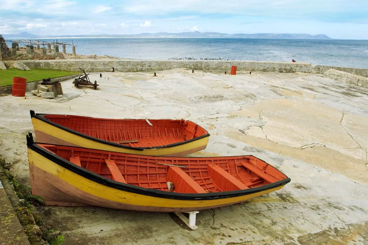 Colourful row boats on the Hermanus Harbour. A popular day trip from Cape Town to see the annual whale migration.