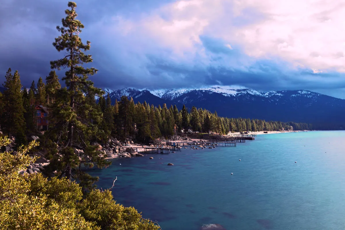 Lake Tahoe, forest and snow capped mountains