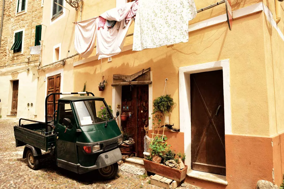 Car hire in Sardinia is the best way to get around and see all the quaint villages with washing hanging out windows and little Ape motorbikes.