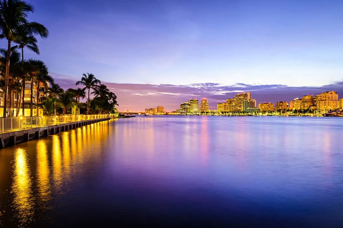 City lights reflecting on the water at dusk in West Palm Beach