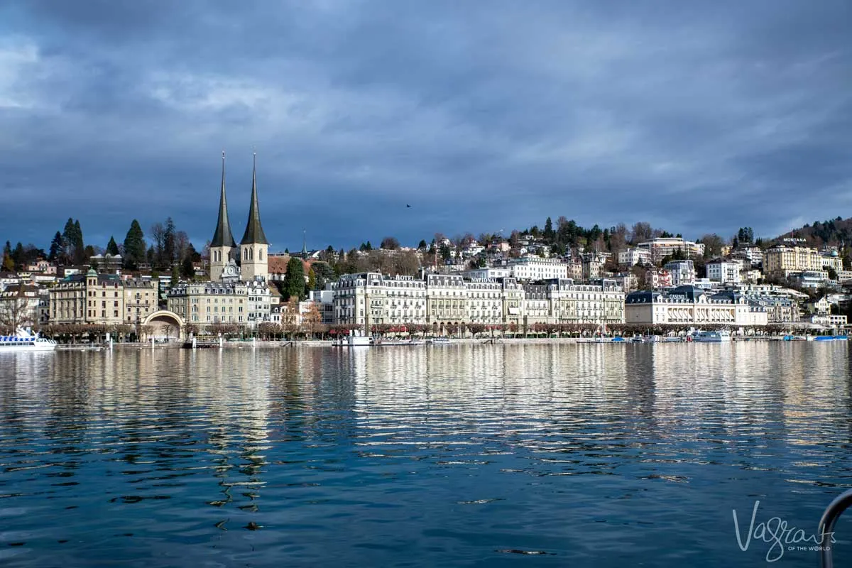  Old town of Lucerne across the lake with the spires of the The Church of St. Leodegar.