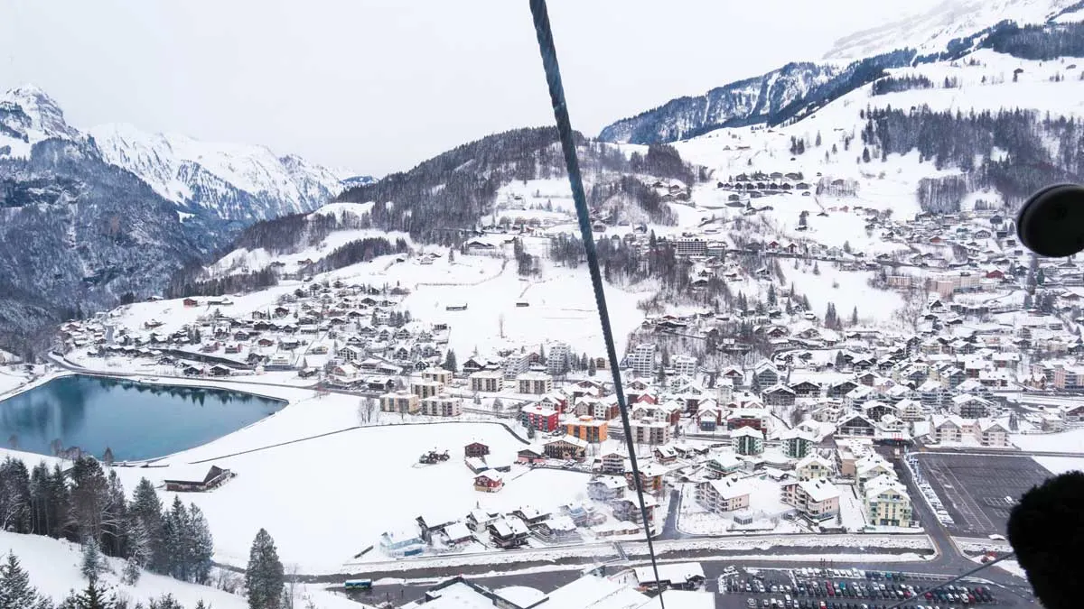 Beautiful snowy views over the mountains from the cable car on the way up to Mount Titlis on a day trip from Lucerne