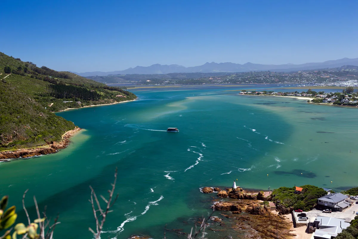 Knysna Lagoon with a single boat on the water. 