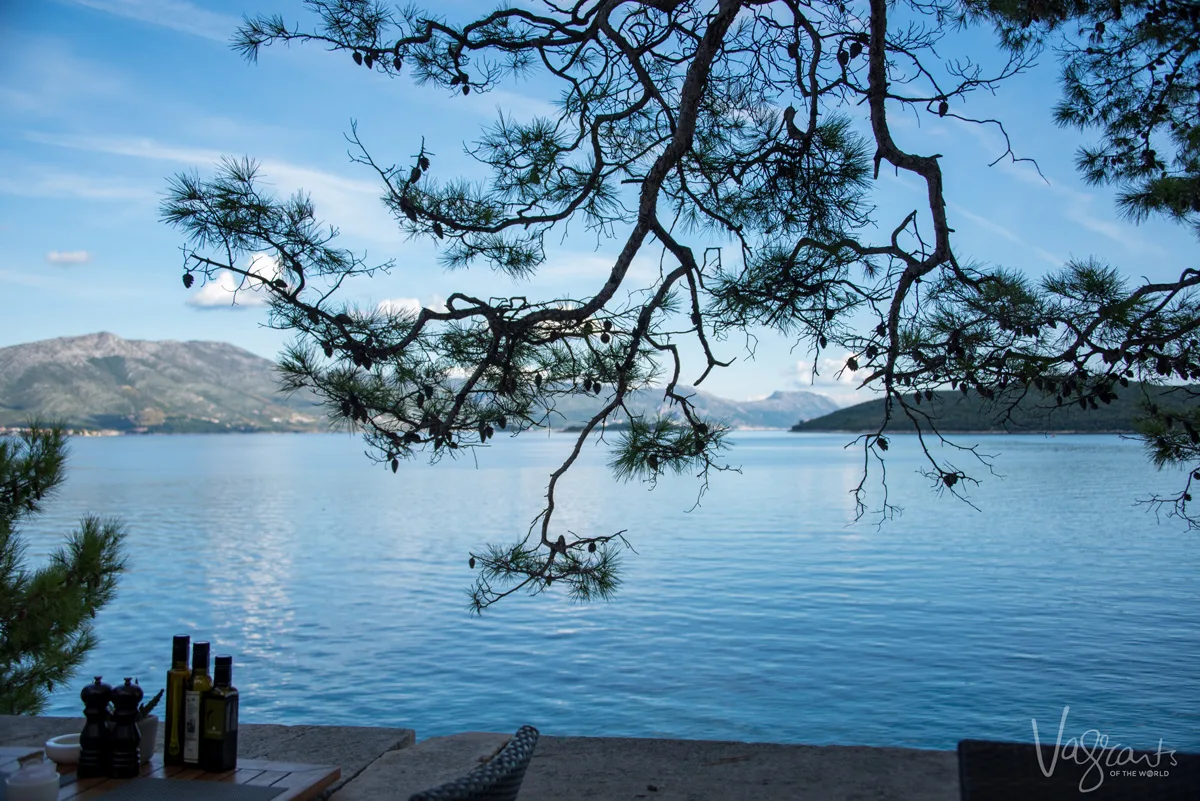 Waterside restaurants under the shade of trees on Korcula Island.