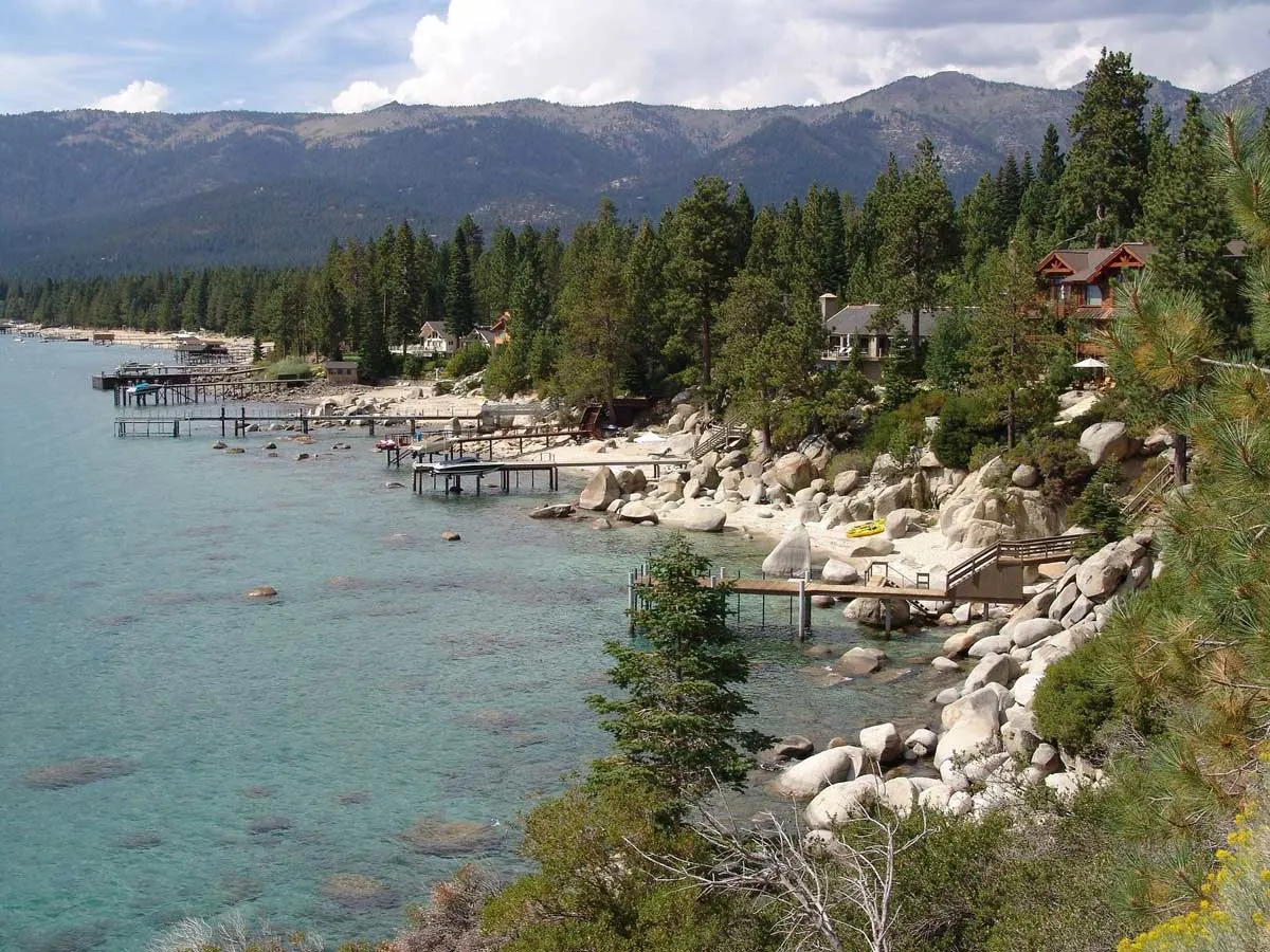 Rocky shoreline and wooden jetties of Kings Beach, North Lake Tahoe