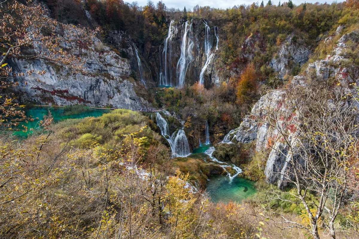 Cascading waterfalls and fall foliage at Plitvice Lakes, Croatia.