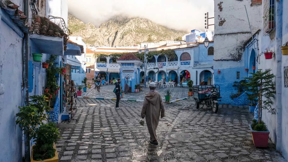 Blue walls and restaurants inside the Chefchaouen medina.