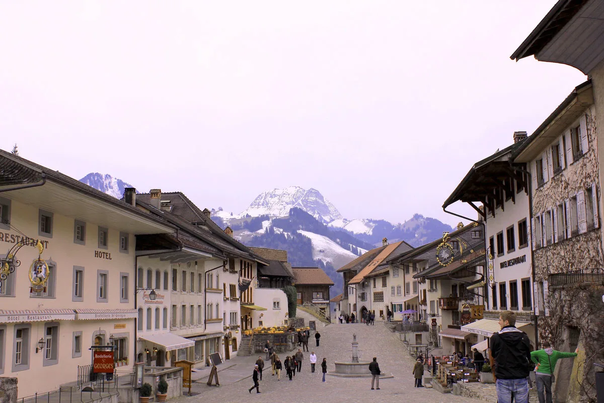 Snow capped mountains overlook Gruyeres old town