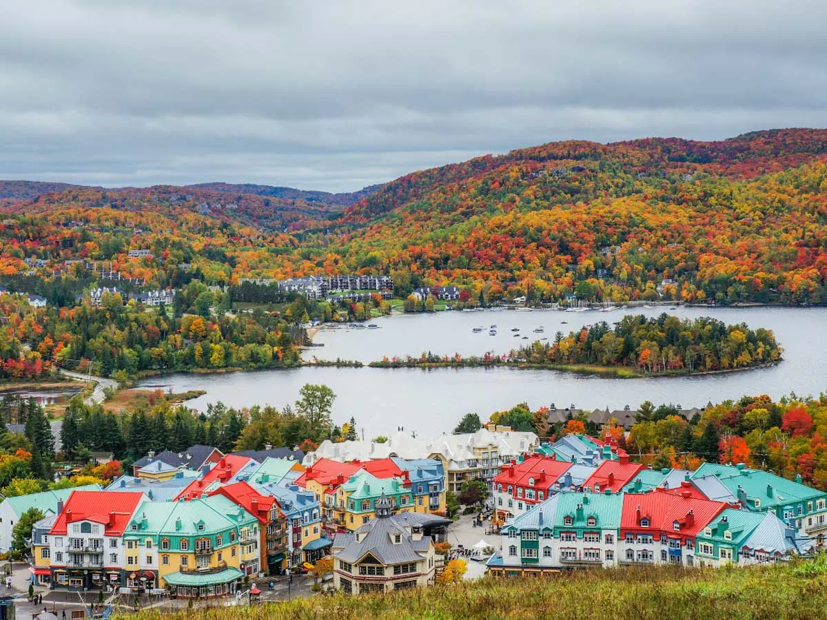The colourful houses of Mont Tremblant with red, yellow and green the same as the surrounding fall colours.