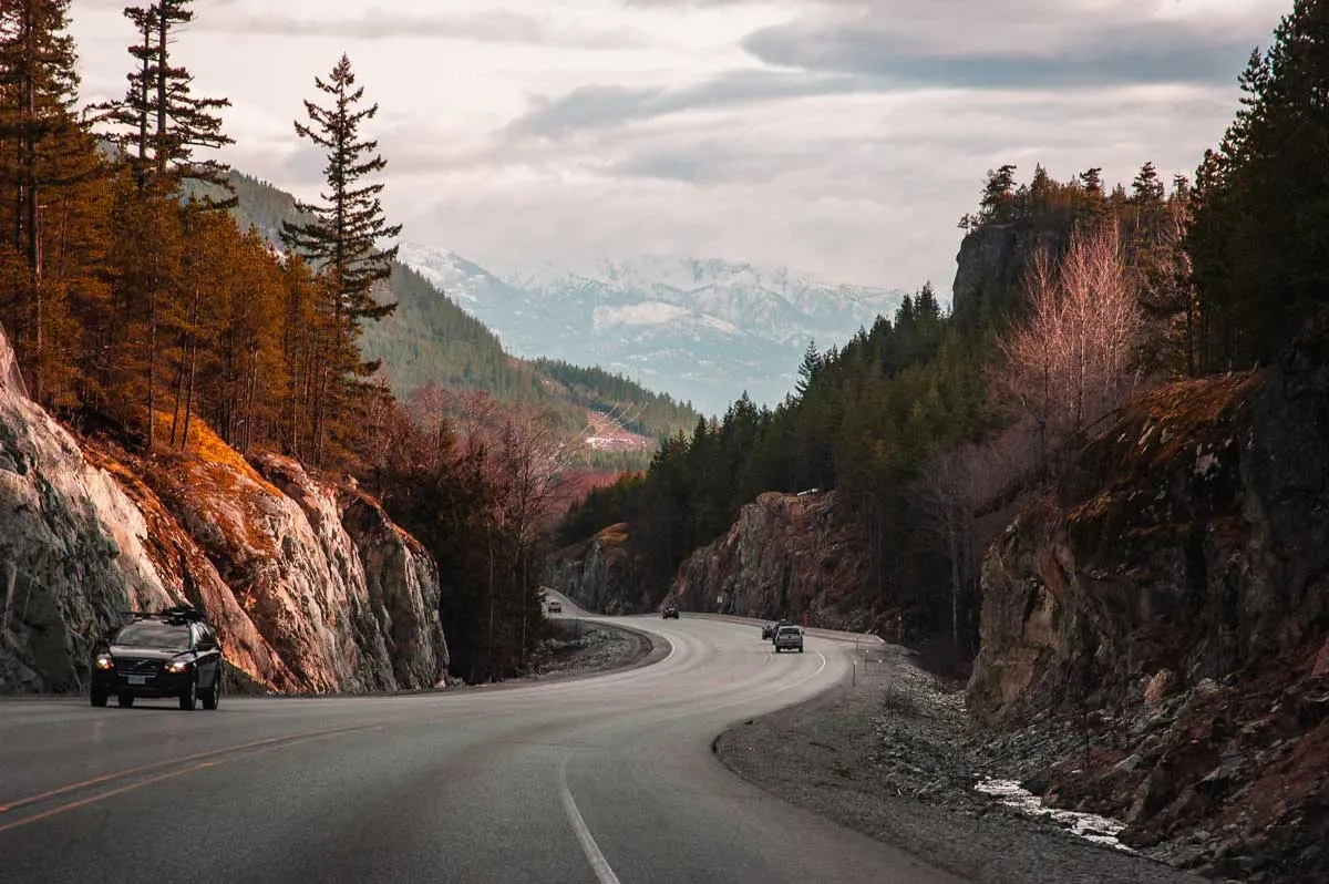 Autumn road trip, roads are not too busy and are lined with fall foliage.