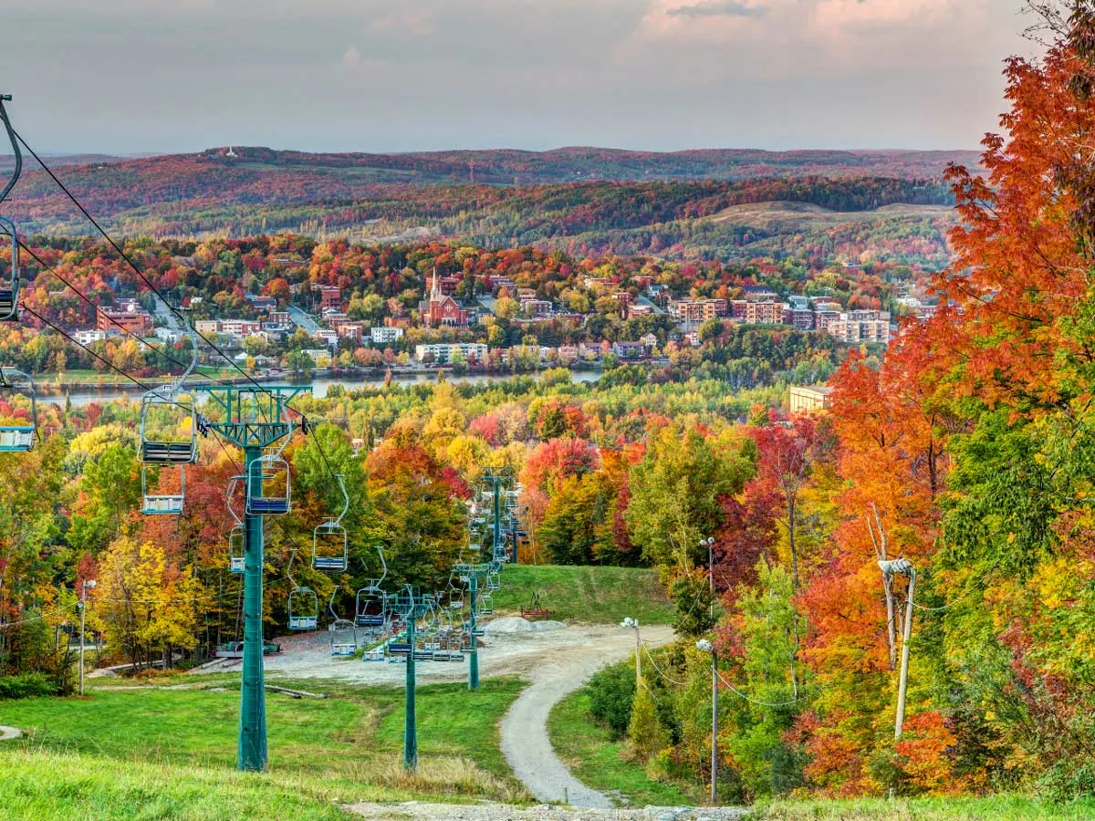 An autumn watercolour, chairlift through the colourful spectrum of foliage in Sherbrooke.