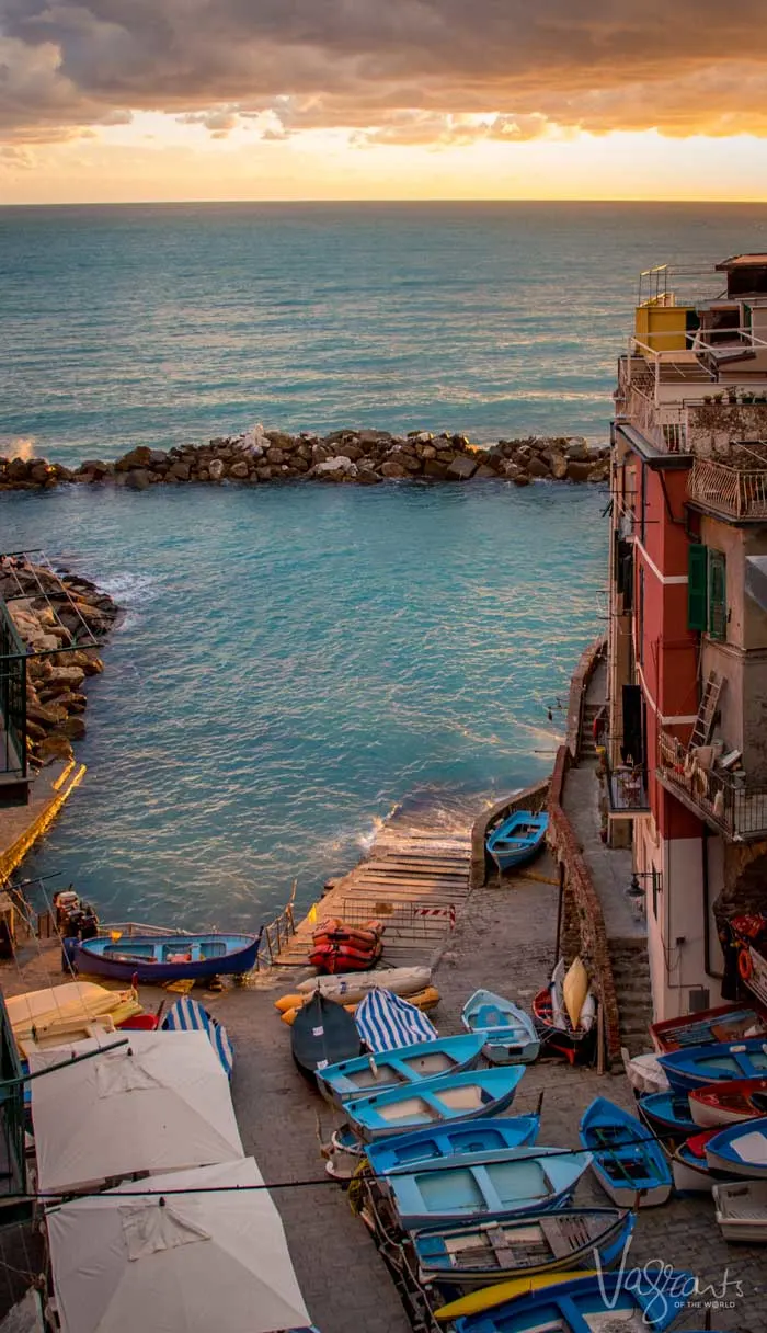 The small blue safe harbour and the little blue boats sitting on the beach in Cinque Terre.