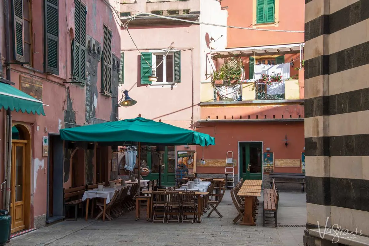 Outdoor dining in the shade at Wonderland Bakery in Monterosso.