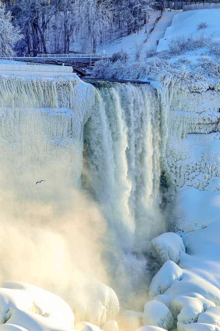 No one in sight and you have the magnificent vista of flowing water and icicles cascading down Niagara Falls all to yourself.
