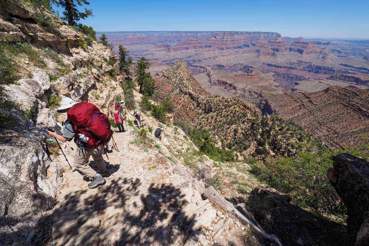 Hikers taking it slow down the steep gravelly sections of the Grand Canyon trails.