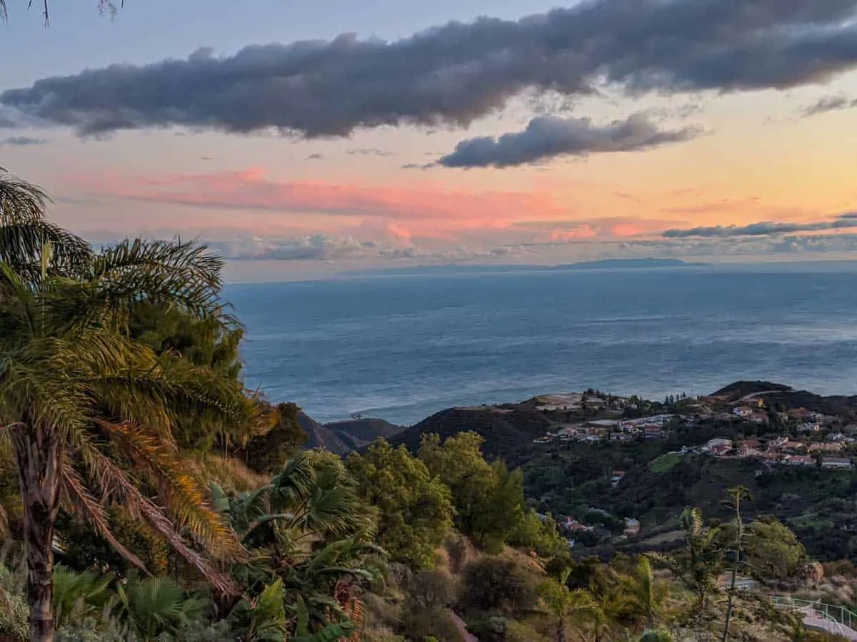 Palm trees, red skies and a gentle ocean, relaxing in Malibu.