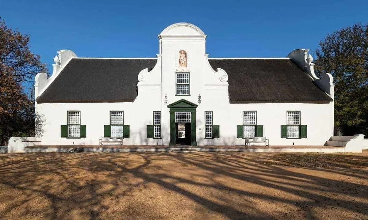 Historic white building at Beau Constantia, a boutique wine farm located at the top of Constantia Nek in Cape Town. 