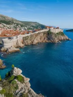 The walled city of Dubrovnik with the contrasting blue of the Adriatic sea.