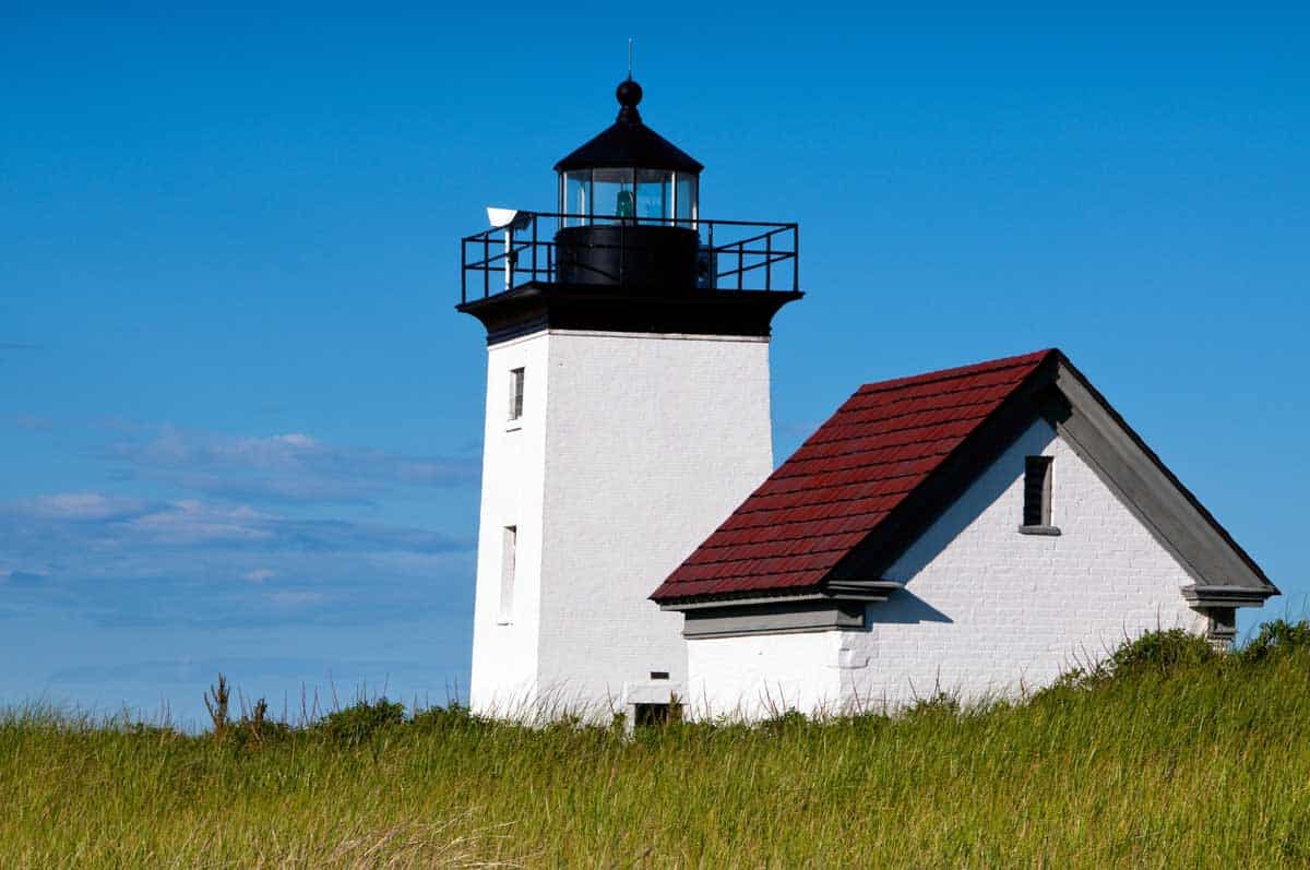 Iconic Cape Cod white lighthouse with red roof at Long Point.