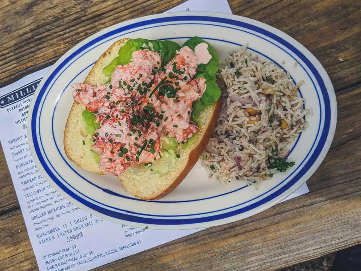 Classic Cape Cod Lobster roll with a side of rice. 
