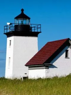 Iconic Cape Cod white lighthouse with red roof at Long Point.