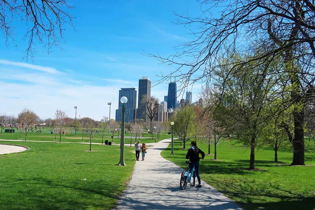 Cyclist and walkers on a bike path in a inner city Chicago park.