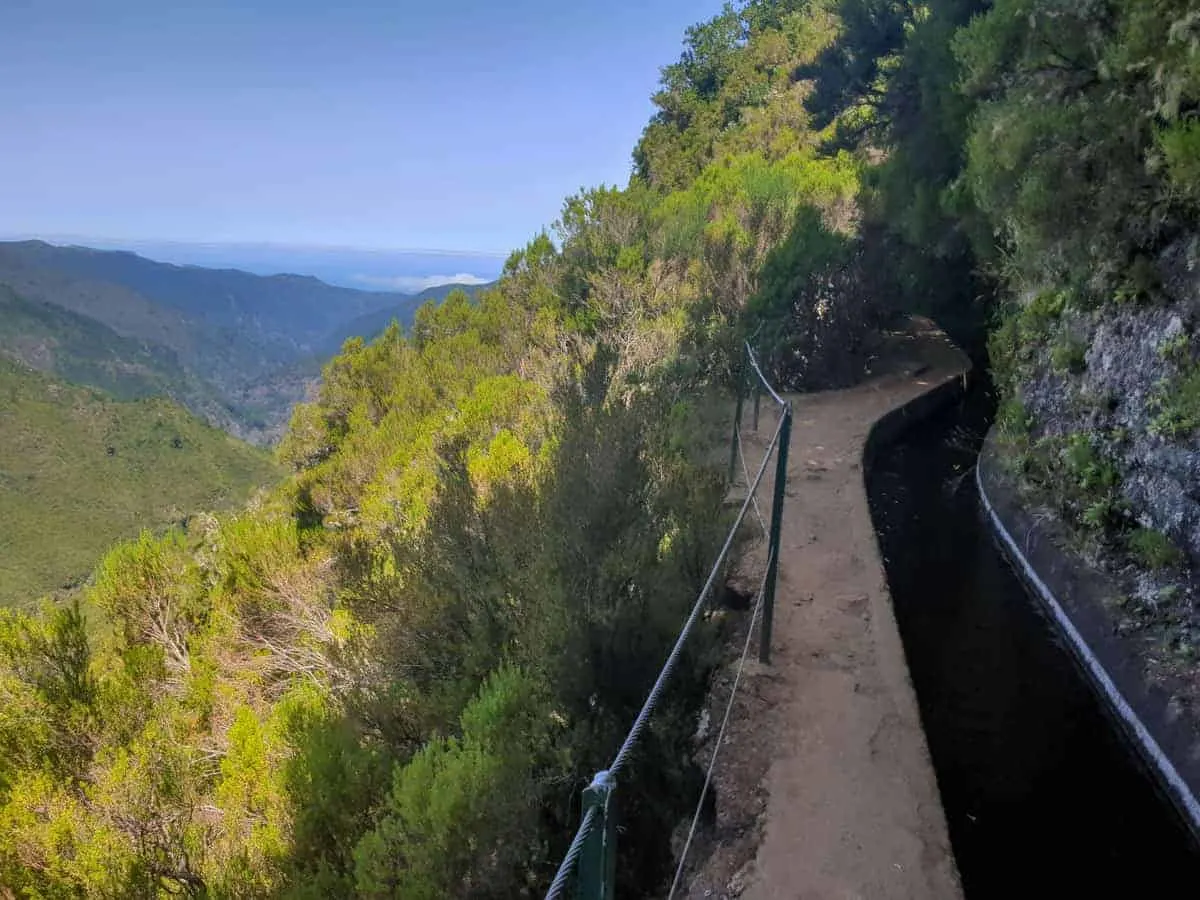 Walking trail with sweeping views along the Madeira levada water channels.