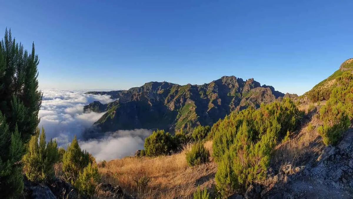View from above the clouds of dramatic mountain peaks on Madeira Island.