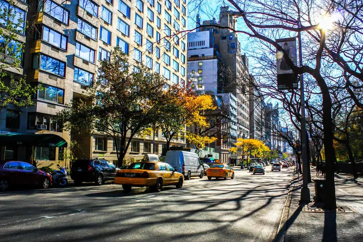 Taxis driving down Fith avenue in New York in fall.