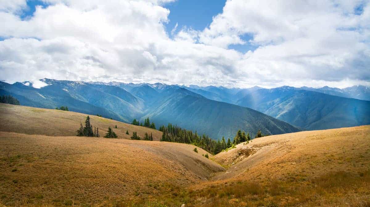 Mountain views from high in the hills across brown meadows.