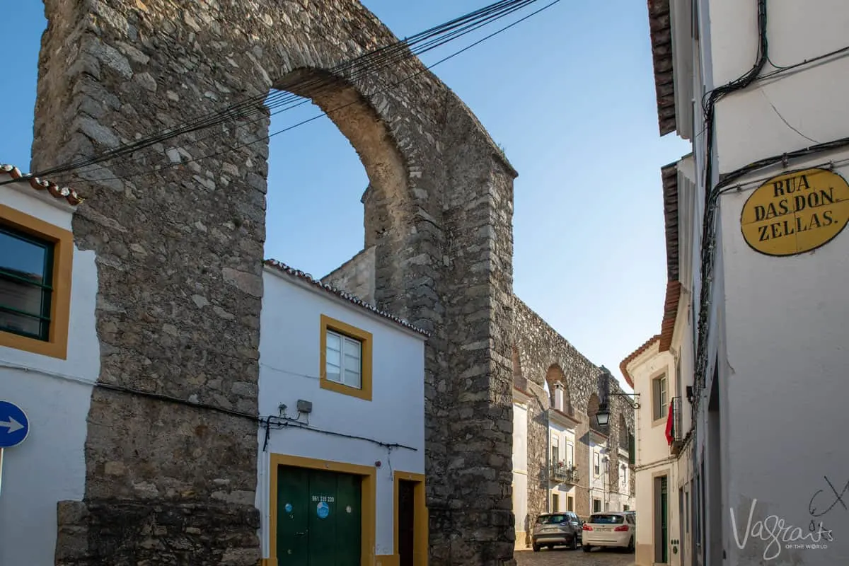 The streets of Evora with houses built into the Aquaduct. 