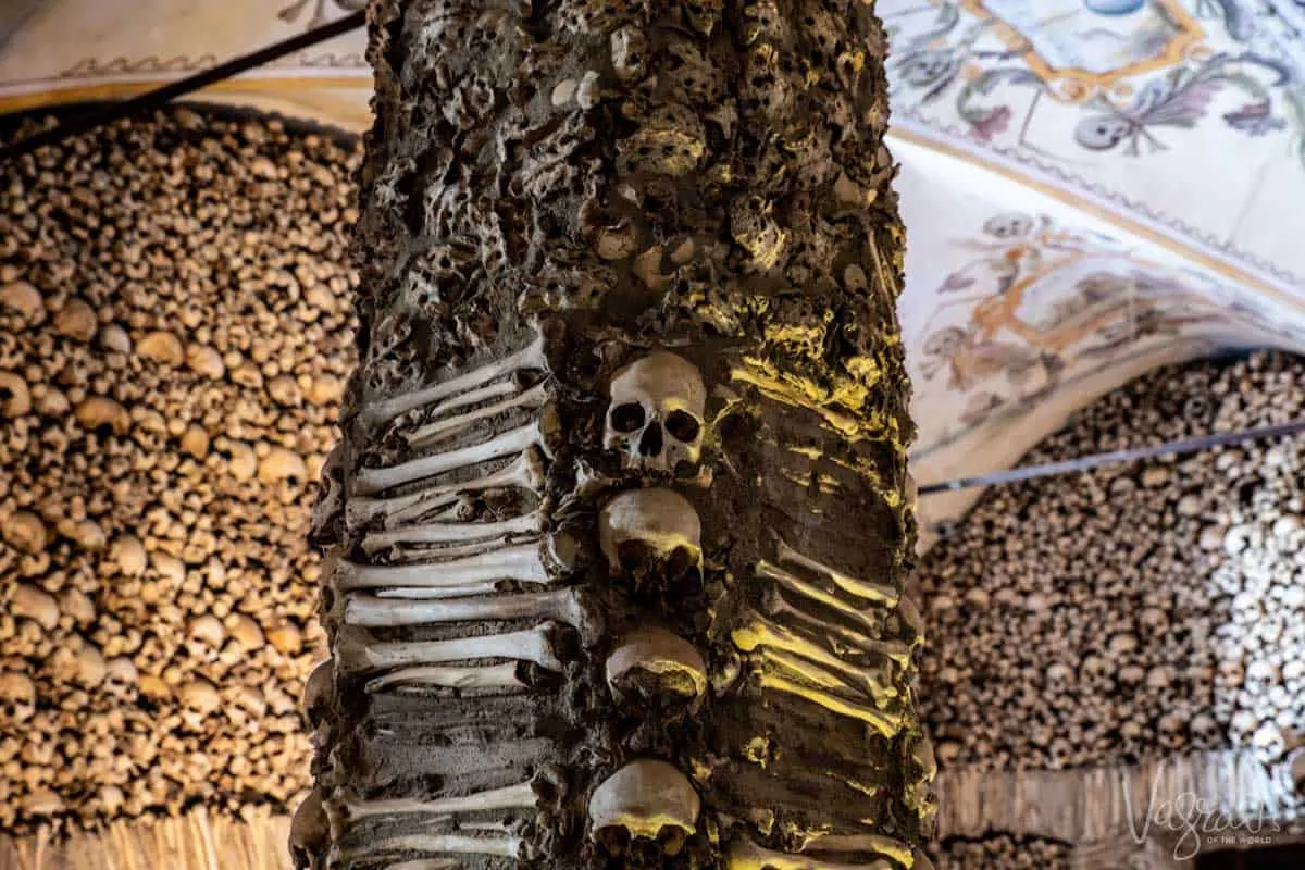 Skulls and bones on the walls of the Capela dos ossos in Evora Portugal. 