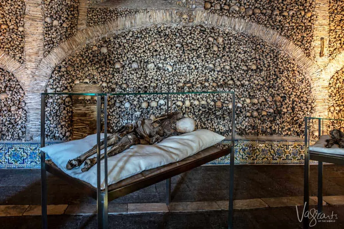 Mummified body on display in the chapel of the bones in Evora.