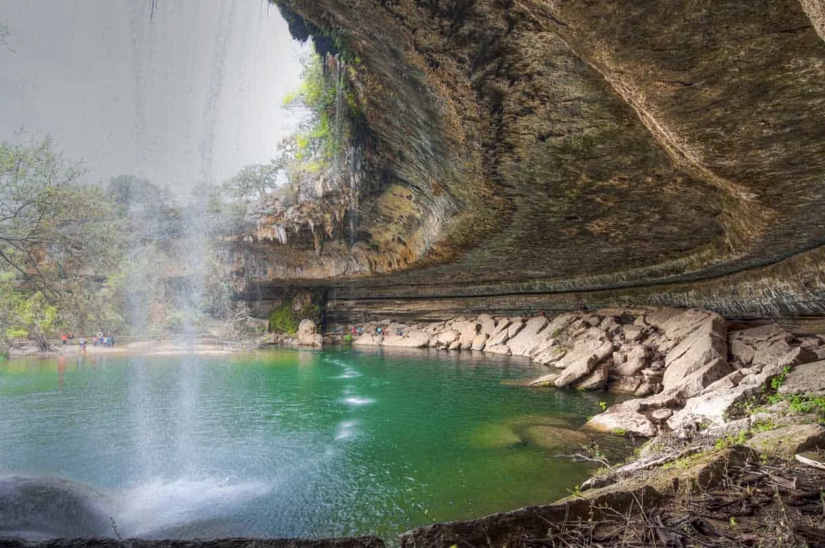 Behind the waterfall at Hamilton Pool Preserve in Dripping Springs Texas. 