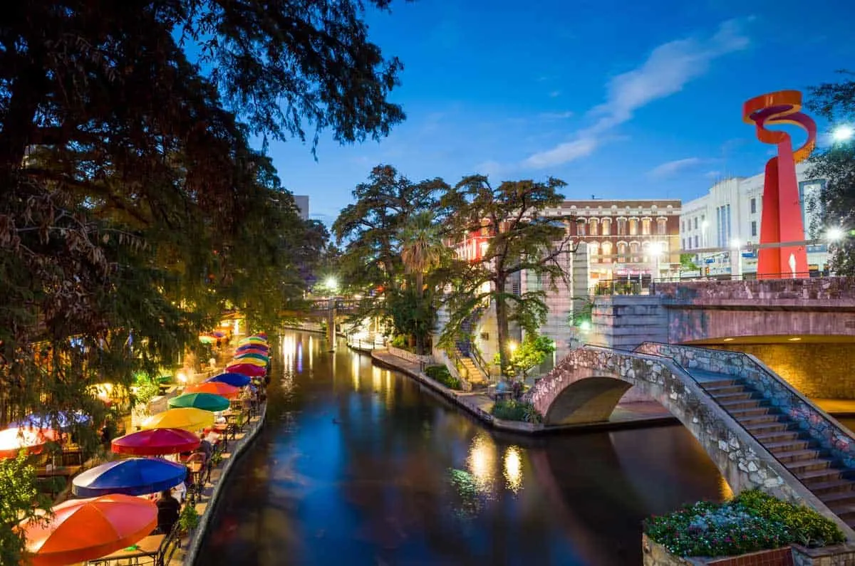 The colourful San Antonio River Walk at night.