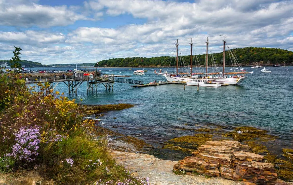 A windjammer tall ship moored at the end of a jetty in Maine.