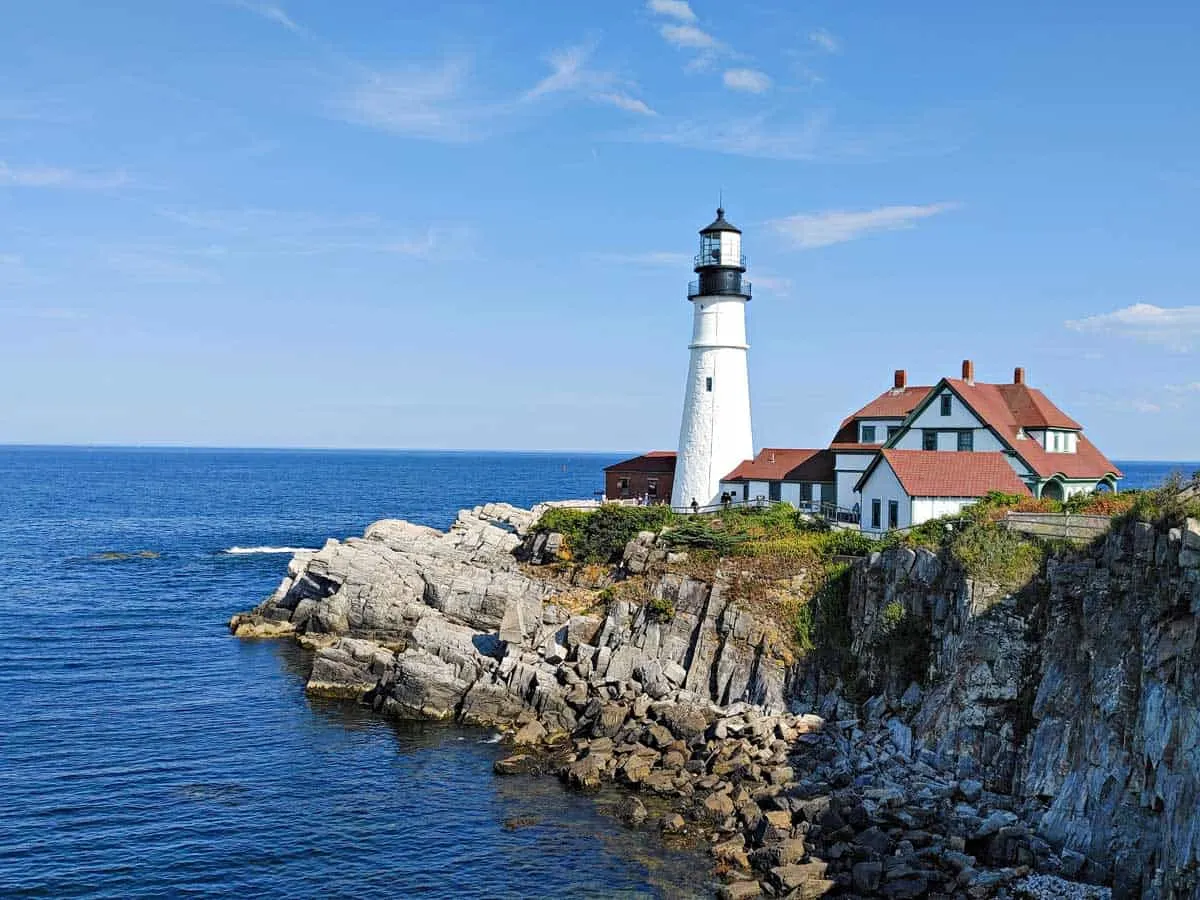 Portland Head Lighthouse with blue sky on a sunny day.