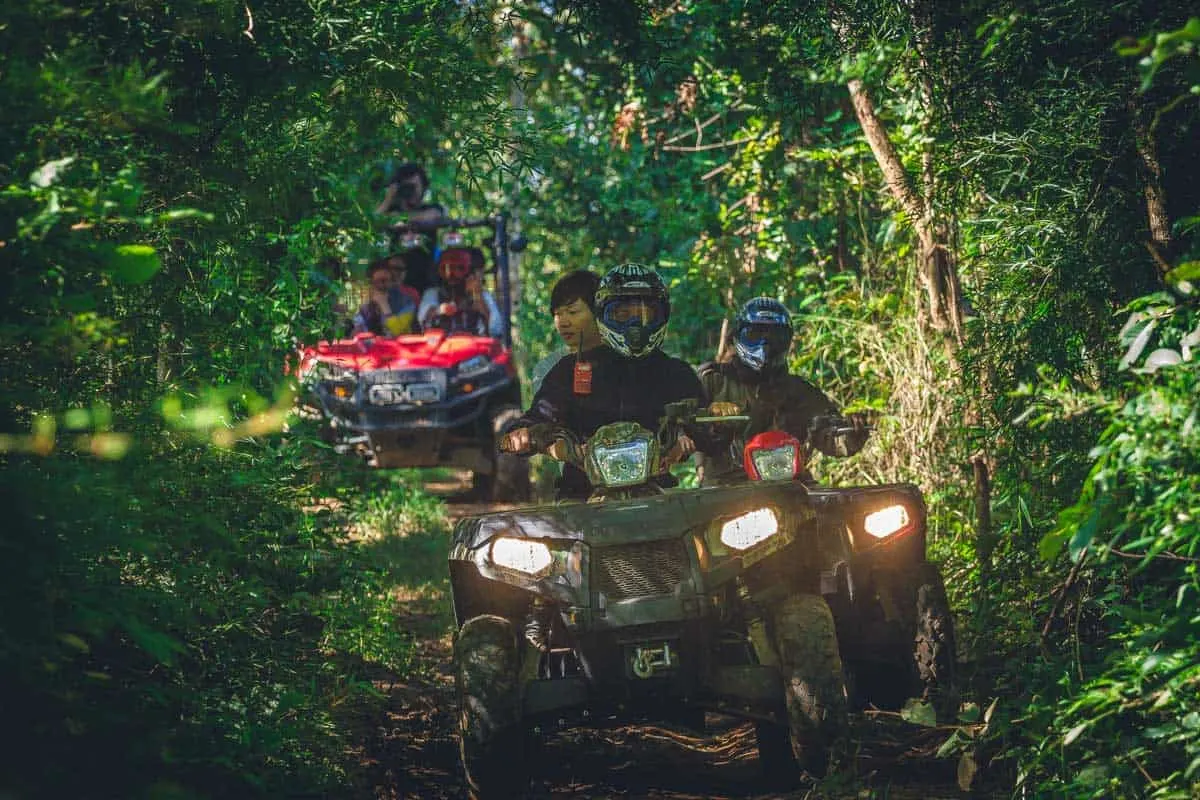 people on an ATV tour in the jungle in Thailand. 