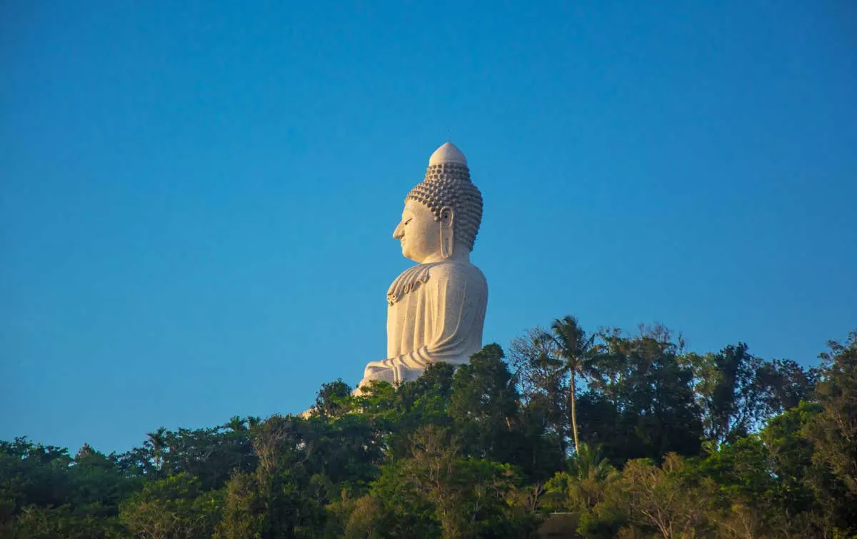 The big Buddah in Phuket Thalaind standing tall above the tree line. 