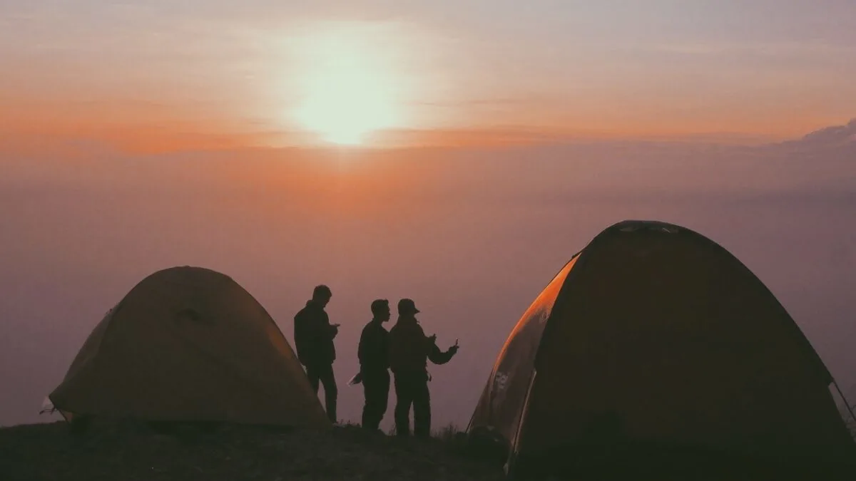 People camping at sunset.