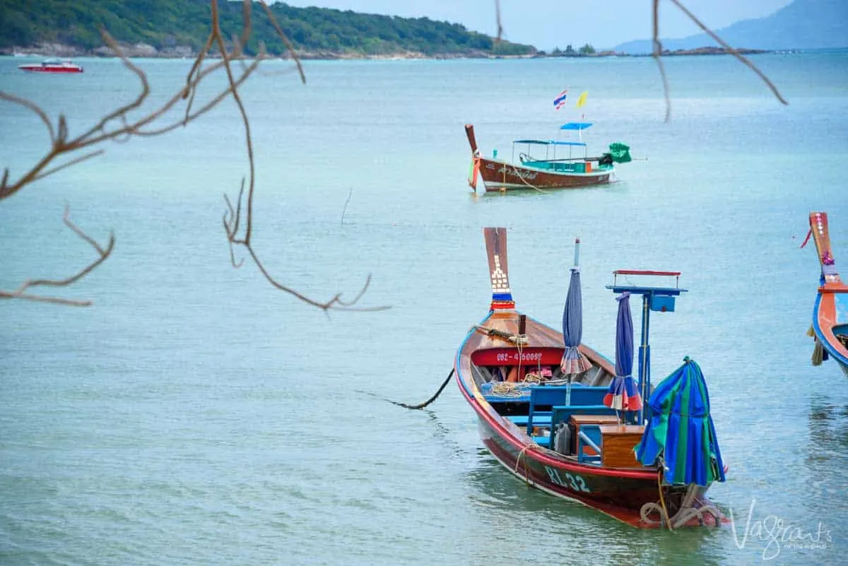Traditional Thai fishing boat in clear blue water