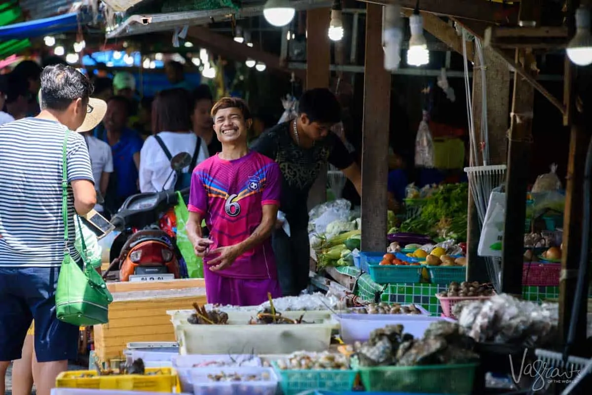 Thai man making a funny face in the seafood market in Phuket.